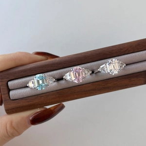 Detailed macro view of S925 sterling silver rings with emerald cut colorful zircons