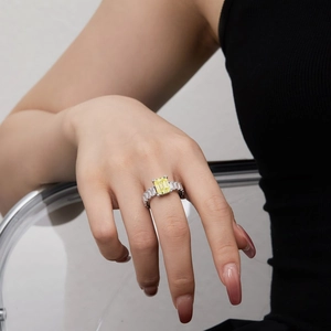 Detailed shot of S925 silver ring featuring a large rectangular yellow zircon and pave stones
