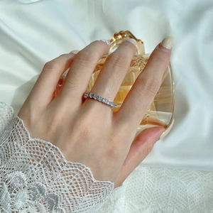 Close-up of S925 sterling silver eternity ring with sparkling row of zircons on hand