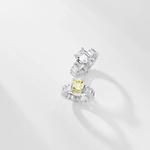 Detailed macro view of S925 sterling silver emerald-cut cubic zirconia wedding rings