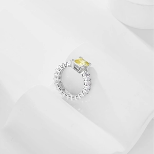 Detail of S925 silver ring featuring a yellow square gemstone and pave set zircon stones