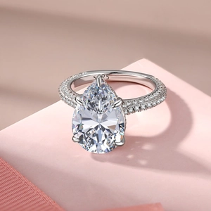 Macro detail of S925 sterling silver ring featuring a large pear-cut teardrop gemstone