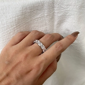 Detail of square-cut cubic zirconia stones set in an S925 sterling silver band