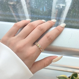 Detail of S925 silver ring featuring colorful heart-shaped pavé set gemstones