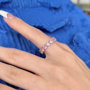 Detailed view of S925 silver ring featuring sparkling pink heart-shaped row diamonds