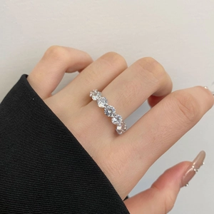 Detail of S925 silver ring featuring a row of sparkling cubic zirconia stones