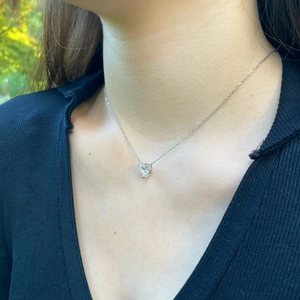 Elegant S925 sterling silver heart-shaped zircon pendant necklace on female model collarbone