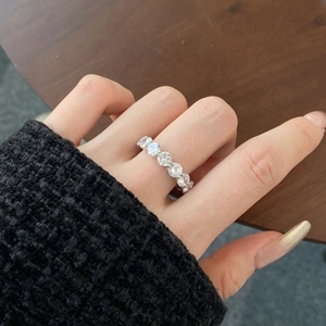 Close-up of S925 sterling silver band ring with seven brilliant round-cut cubic zirconia