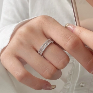 Macro detail of French style 925 silver ring featuring baguette-cut sparkling cubic zirconia