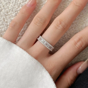 Detail of S925 sterling silver eternity ring with rectangular and round cubic zirconia