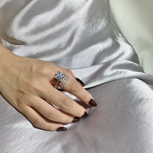 Close-up of S925 silver wedding ring set with princess cut cubic zirconia stones