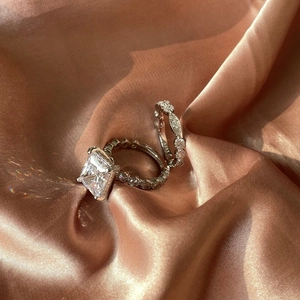 Macro shot of S925 sterling silver bridal ring set with princess cut cubic zirconia