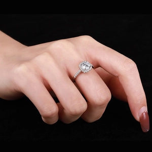 S925 sterling silver ring featuring a classic halo round-cut zircon on model hand