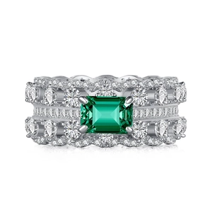 Luxurious S925 silver ring featuring emerald-cut green gemstone and double row zircons