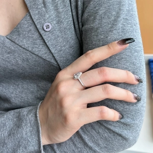 Side view of S925 sterling silver ring with pear-shaped water drop zircon and pave band