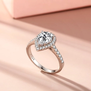 Macro shot of S925 sterling silver hallmark and pear cut halo engagement ring