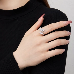 Elegant S925 sterling silver open ring with irregular cubic zirconia and pear cut stone