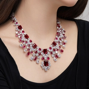 Close-up of S925 silver necklace with luxury red ruby style stones and zircon on model