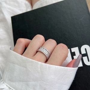S925 sterling silver wide band ring with olive pattern cubic zirconia shown on model
