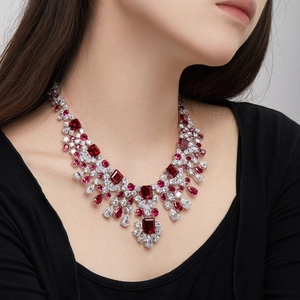 Close-up of luxury S925 silver necklace with deep red rubies and zircon on a model