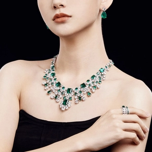 Detailed view of luxury S925 silver necklace set with emerald zircons and white diamonds