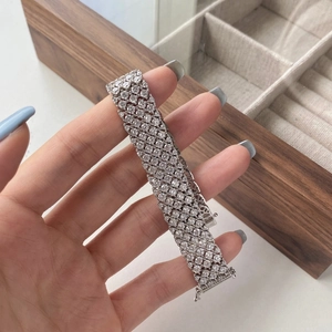 Detailed view of luxury silver-tone wide mesh tennis bracelet with full pave zircon stones
