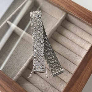 Macro shot of wide S925 sterling silver mesh tennis bracelet with pave cubic zirconia