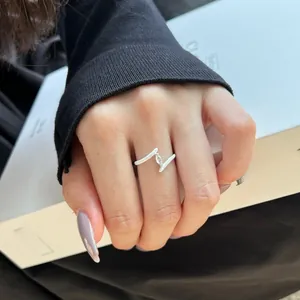 Detail of S925 silver ring featuring white enamel V-shape and marquise-cut zircon stone