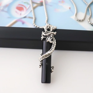 Sleek stainless steel necklace featuring a dragon wrapped around a black cylinder pendant