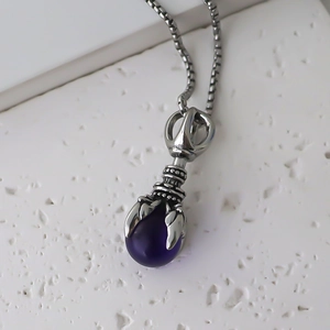Gothic silver dragon claw pendant with purple gemstone on a fine box chain necklace
