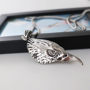 Antique silver eagle head pendant necklace with detailed feather texture and sturdy chain