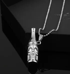 Macro shot of silver bottle-shaped skull pendant and polished bead chain for men