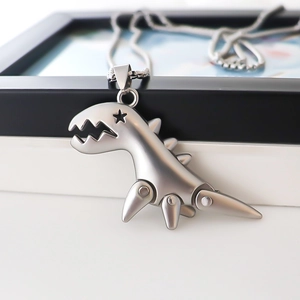 Industrial style silver dinosaur pendant necklace with star eye and mechanical joints