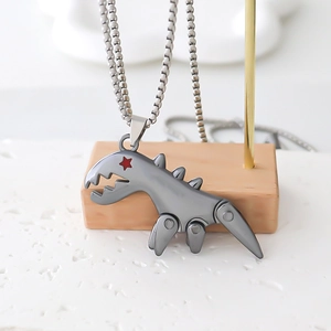Mechanical dinosaur pendant necklace in industrial style with red star eye detail