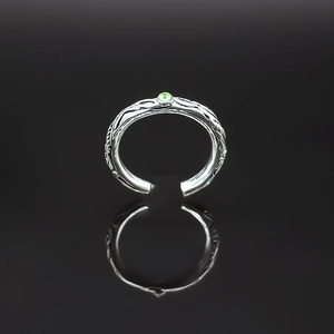 Retro silver open ring with textured band and sparkling round green gemstone centerpiece