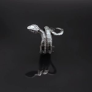 Polished alloy black mamba snake ring with detailed scale texture on dark background