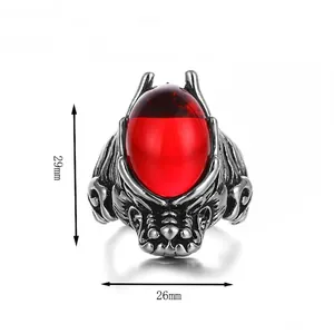 Gothic dragon head ring with large oval red gemstone and vintage silver relief finish