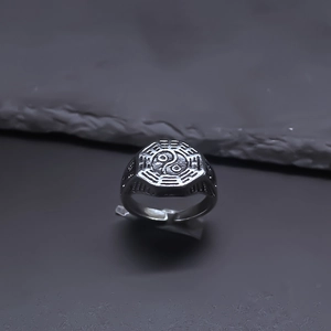 Detailed macro shot of vintage silver Tai Chi Bagua ring with an adjustable open band