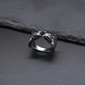 Detailed close-up of retro silver double-headed snake ring with intricate scale textures