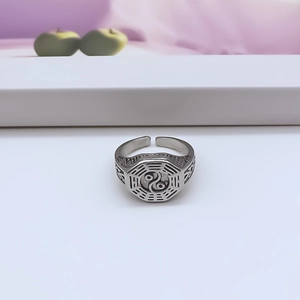 Detail of retro Tai Chi Bagua ring featuring intricate hollow woven texture patterns
