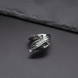 Detailed macro view of punk style adjustable crocodile ring with realistic scale texture