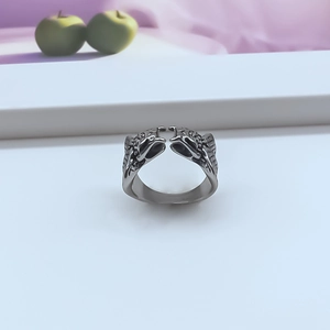 Close-up of vintage alloy double snake open ring with intricate gothic relief carving