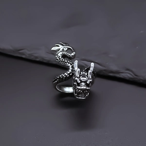 Retro dragon wrap open ring in antique silver finish for men and women on rock background