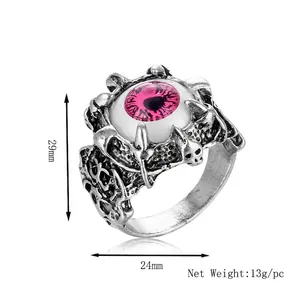 Gothic silver punk ring with a realistic pink evil eye and skull skeleton design