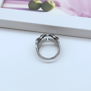 Vintage silver open ring with hugging hands design in a retro gothic metal style