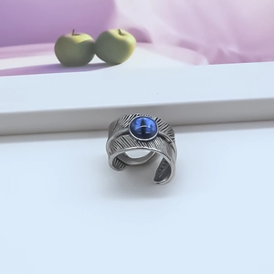 Vintage punk feather ring in alloy with a blue cat eye stone and adjustable open band