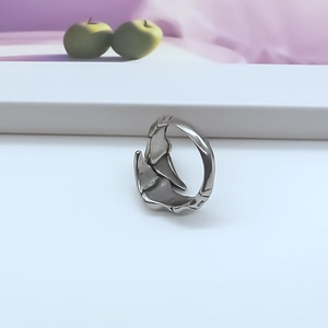 Vintage punk liquid metal style silver adjustable ring for men and women on a display stand
