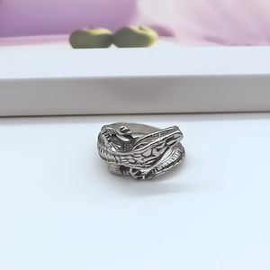 Macro shot of silver punk dragon ring showcasing detailed 3D scales and metal texture
