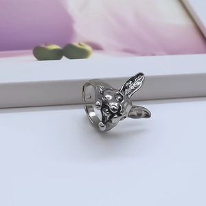 Macro shot of silver rabbit head ring showing vintage texture and adjustable open band