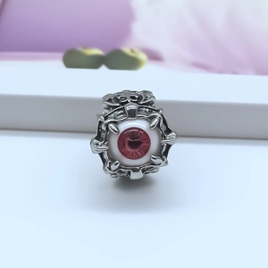 Gothic silver punk ring featuring a realistic red devil eye held by metal claws
